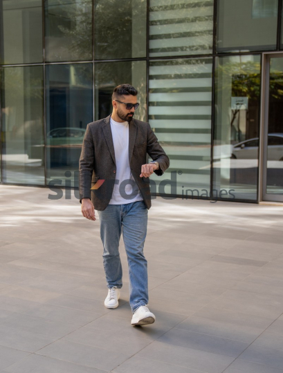 Professional Man Exiting Corporate Building