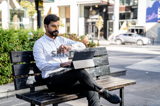 Professional Man Waiting for Online Meeting Outdoors