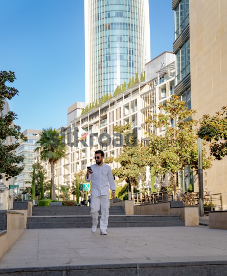 Professional Man Walking Through Al Abdali Boulevard, Amman