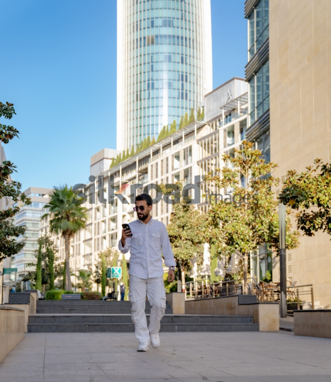 Professional Man Walking Through Al Abdali Boulevard, Amman
