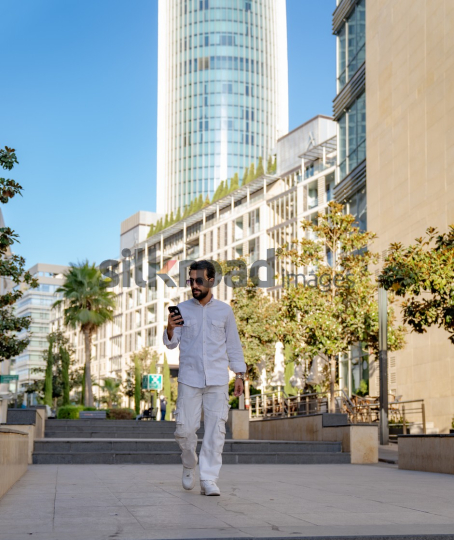 Professional Man Walking Through Al Abdali Boulevard, Amman