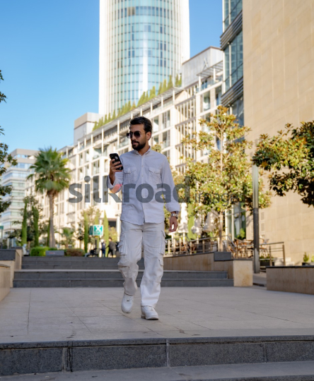 Professional Man Walking Through Al Abdali Boulevard, Amman