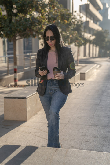 Professional Woman Enjoying Morning Coffee in Al Abdali Boulevard