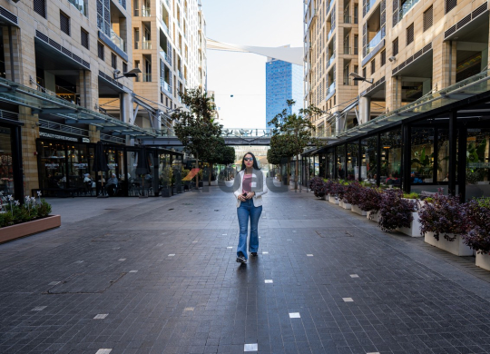 Professional Woman Walking to Work on Al Abdali Boulevard, Amman