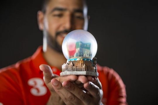 Expat holding crystal ball|-
