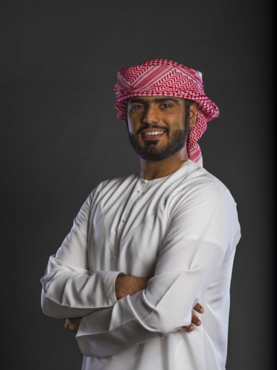 Middle Eastern man standing arms crossed
