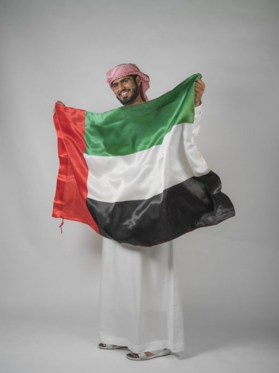 Man carrying the UAE flag 