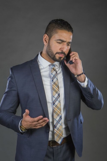 An Arab Businessman talking on the phone|-