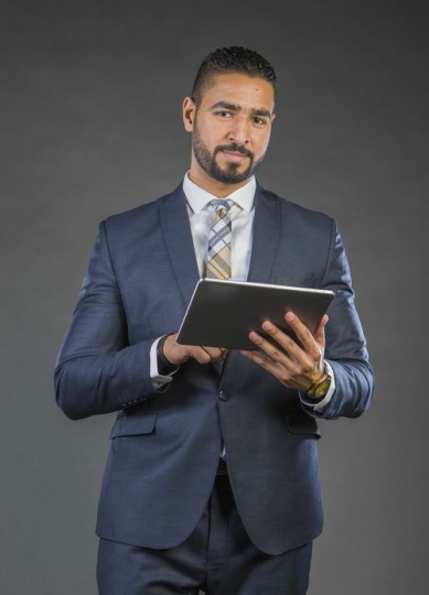 Arab Businessman using device|-