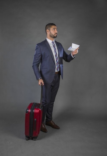 Businessman checking flight board|-