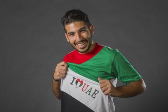 Middle Eastern man embracing his love for the UAE