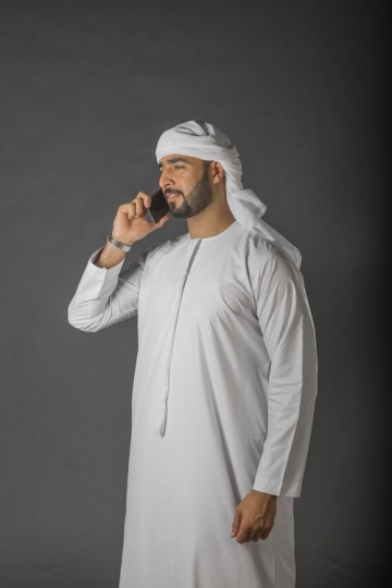 Arab Businessman speaking on the phone|-