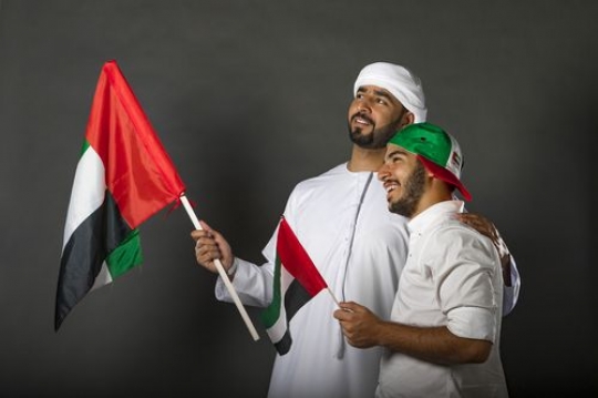 Two happy men celebrating the UAE National Day