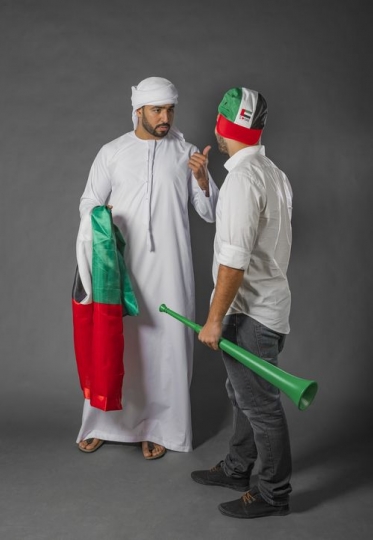 Two men talking about National Day