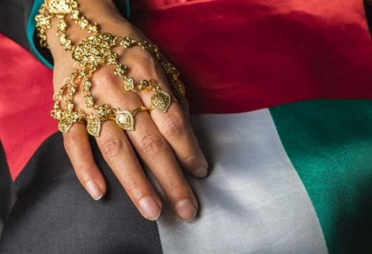 Close up of a Women holding a UAE Flag