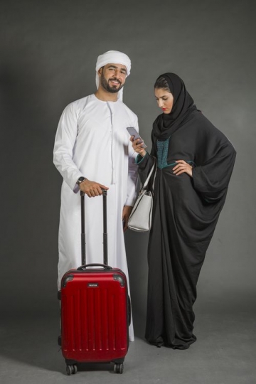 Middle Eastern couple traveling together|-