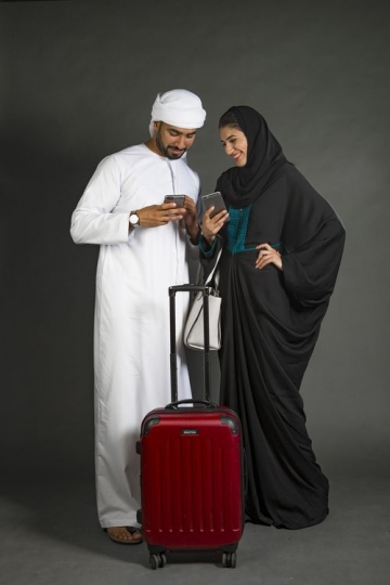 An Arab couple traveling together|-
