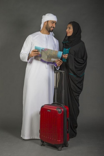 Middle Eastern couple traveling together|-
