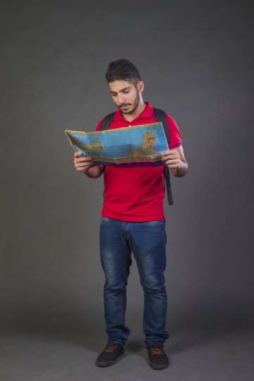 Young Arab man looking at the map|-