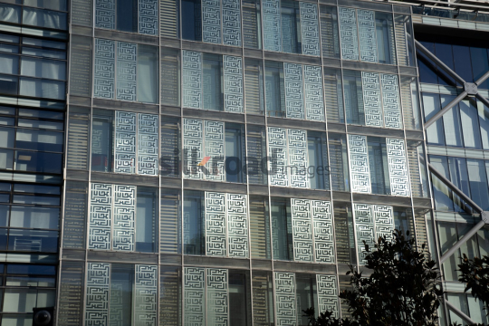 Stunning View of Al Abdali Boulevard with Sunlit Glass Building Wall