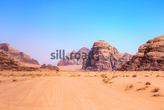 Stunning View of Wadi Rum Desert, Jordan with Rock Formations and Blue Sky