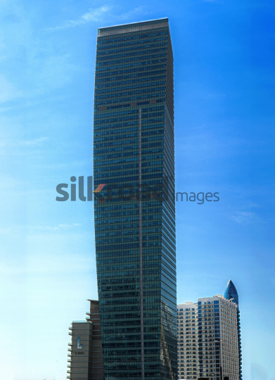 Tall Tower in Dubai Under Clear Blue Sky