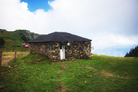 Traditional Stone House in Mountainous Landscape