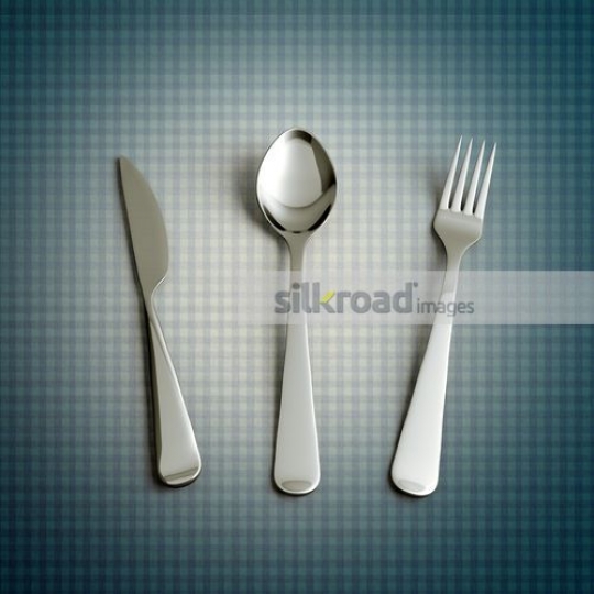 utensils set on a blue table cloth