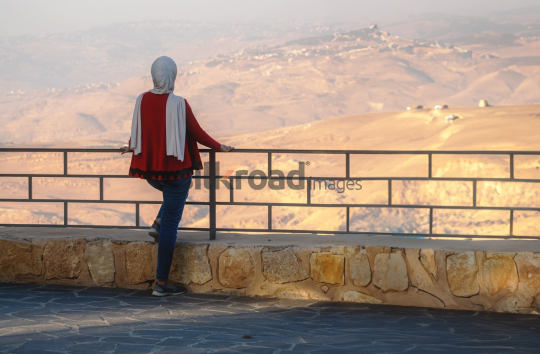 Woman Enjoying the View from Jabal Nebo at Sunset, Madaba