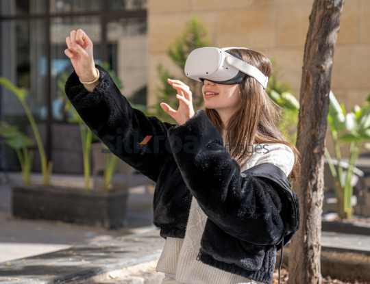 Woman Experiencing Virtual Reality Outdoors