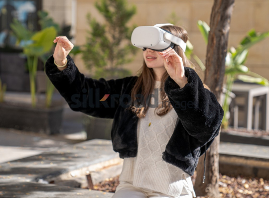 Woman Experiencing Virtual Reality Outdoors