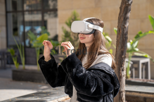Woman Experiencing Virtual Reality Outdoors