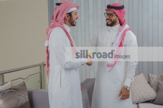 Arab Businessmen shaking hands after a meeting|