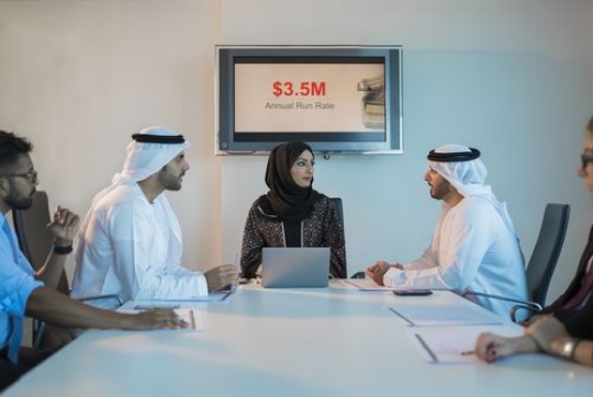 Businesspeople during a meeting|-